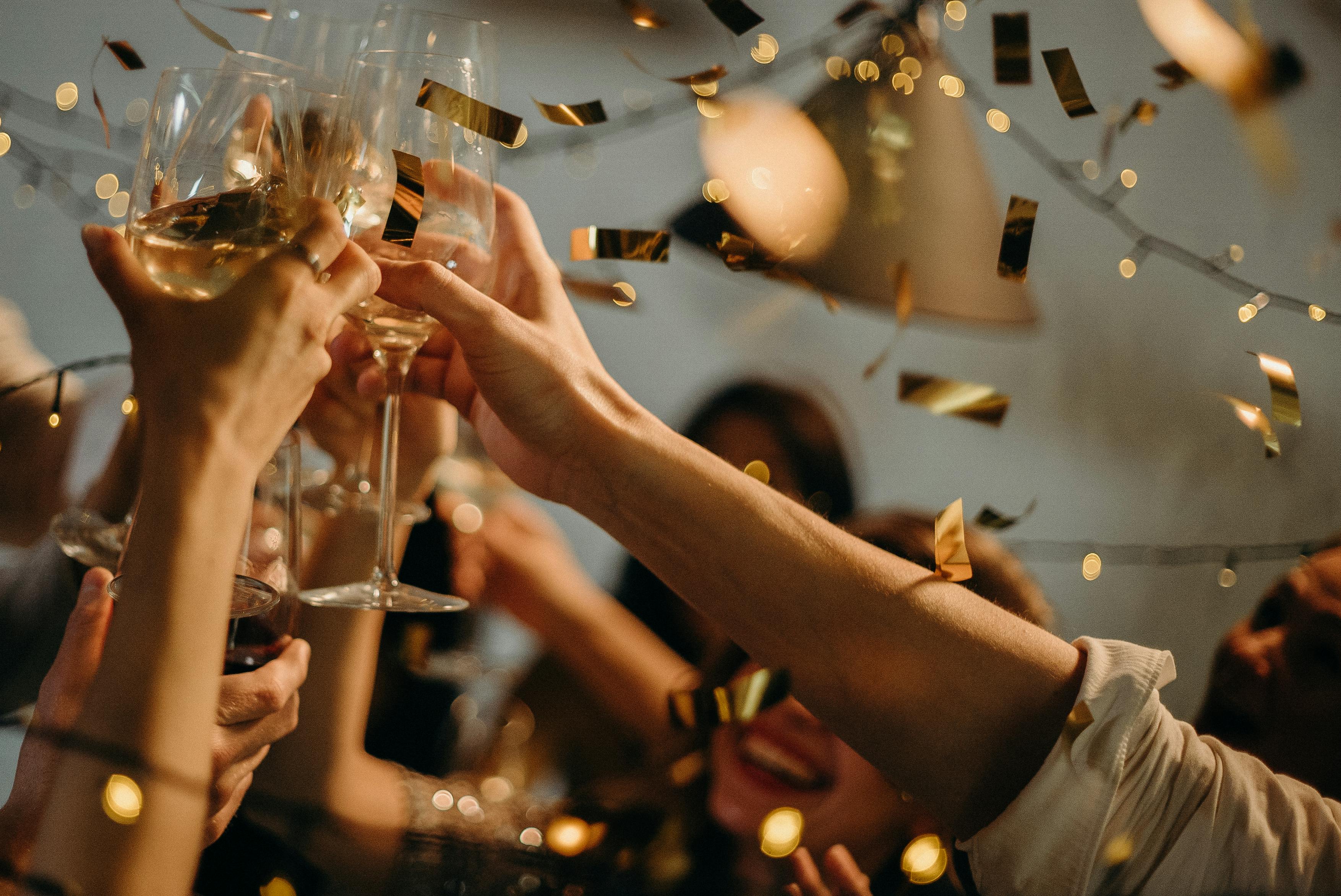 People raising champagne glasses